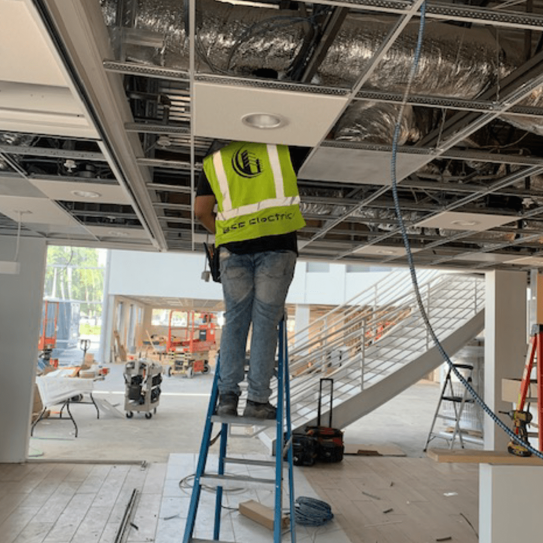 BSF Electric employee fixing electric wirings in a building